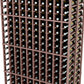 Close-up of wine bottle slots in a double-deep dark wood rack