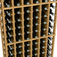 Wine bottle rack detail, light wood frame with rows of wine bottles