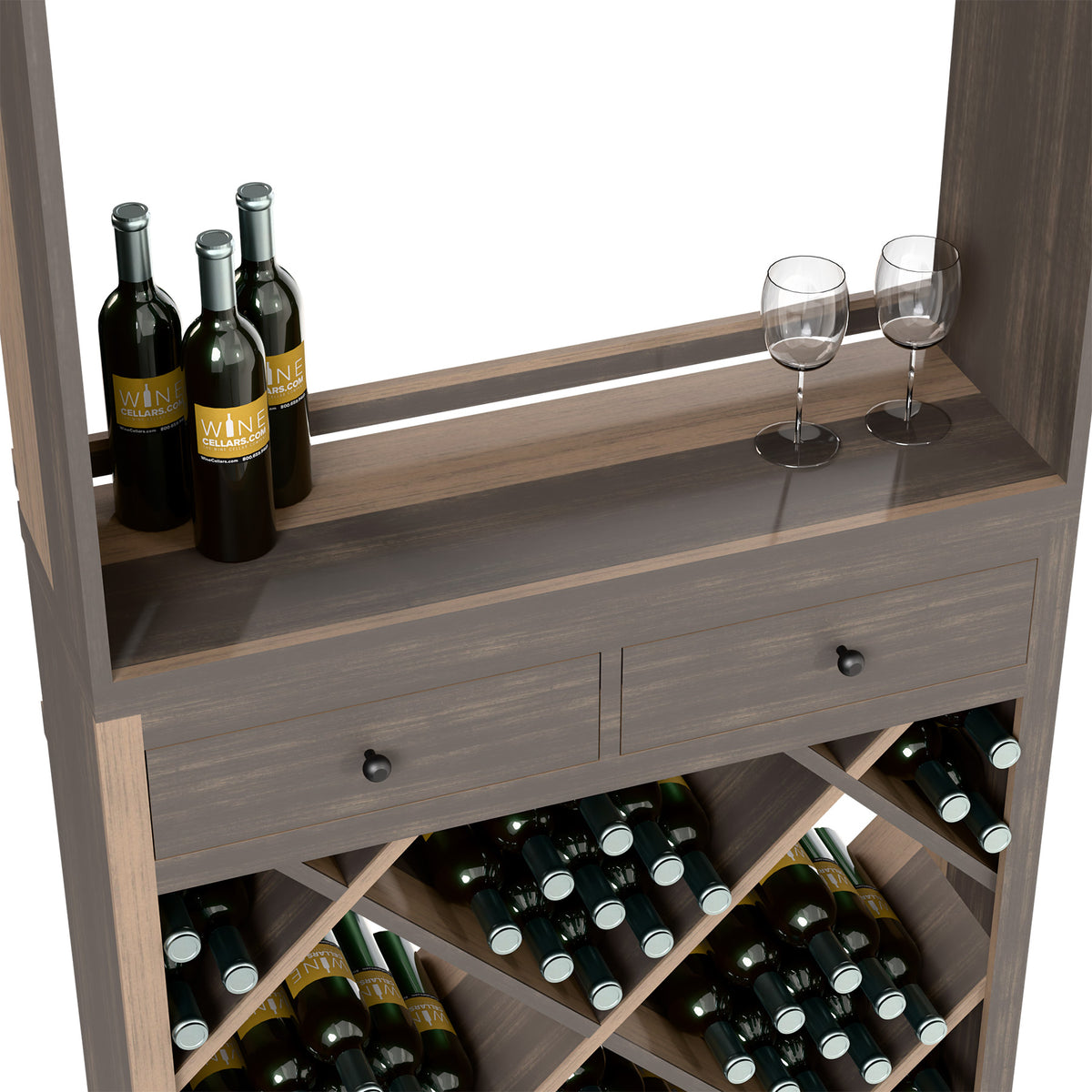 Grey wine cabinet front with glassware on top and bottles in diagonal wooden cubbies.