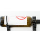 Wall-mounted bottle retention strap, black clips securing a bottle on a bar