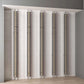 Set of wall-mounted frame extension brackets with metallic finish on multiple vertical supports