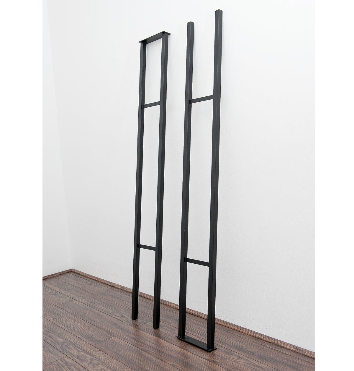 Floating wall frame set with tall black rails and horizontal dividers