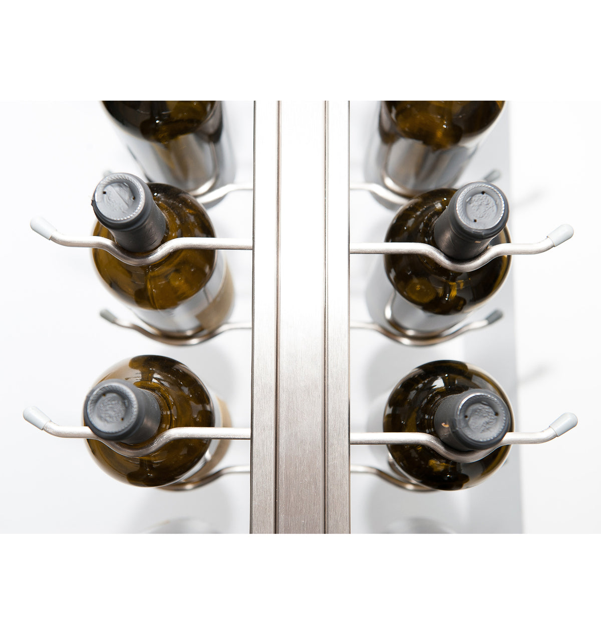 Floating wall frame with golden bronze rails holding wine bottles behind