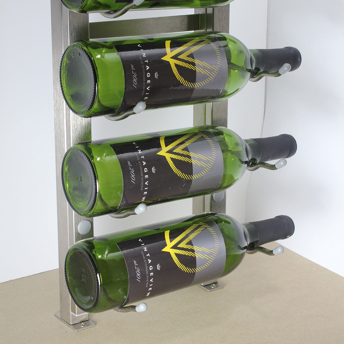 Wall wine bottle display frame with green bottles and metal hidden base mounts