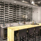 Large wall grid of single-sided floating wine racks with multiple bottle holders