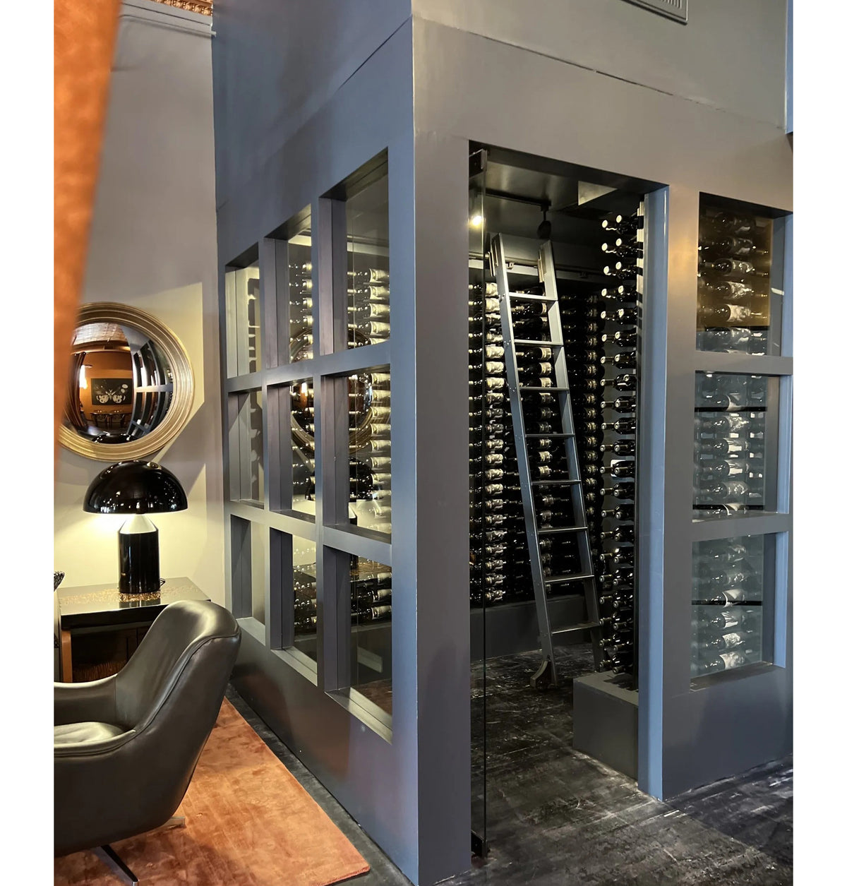 White-framed single-sided floating wine rack display with bottle holders