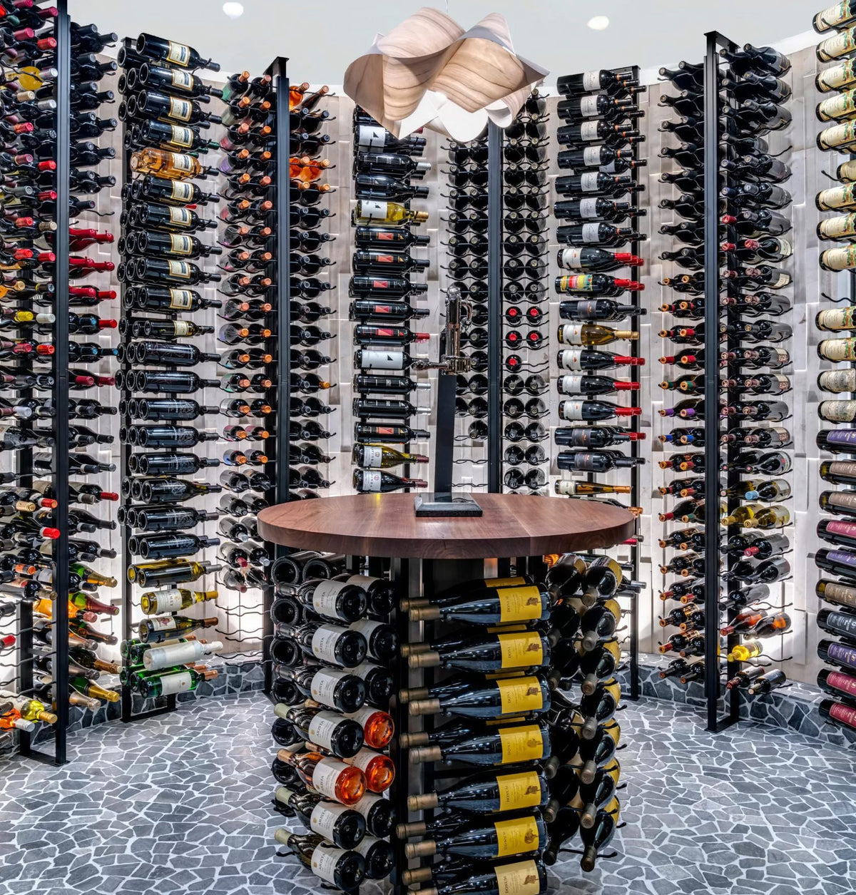 Double-sided wine rack display with stacked wine bottles and a central wooden stand