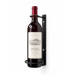Wall-mounted wine bottle perch, black metal backplate with bottle ring and red-capped bottle
