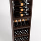 Front view of tall wine cabinet with bottle holder rails, wine cubbies, and glass bottle bins