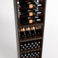 Tall wine cabinet interior with bottle rail display, cubby shelf, and stacked bottle bin rows