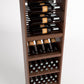 Wine storage cabinet front with bottle rails, cubby shelves, and two rows of bottle bins