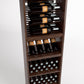 Wood wine cabinet interior with bottle rails, open shelves, and lower wine-bottle cubbies