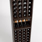 Dark wood wine bottle rack interior showing bottle rows and glass display shelf