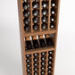 Light wood wine bottle rack interior with bottle rows, glasses, and center shelf