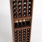 Wood wine bottle rack with four columns, front display shelf with bottles, lower bottle cubbies