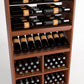 Wood wine rack with bottle rails, angled bottle shelf, and multi-compartment bin storage