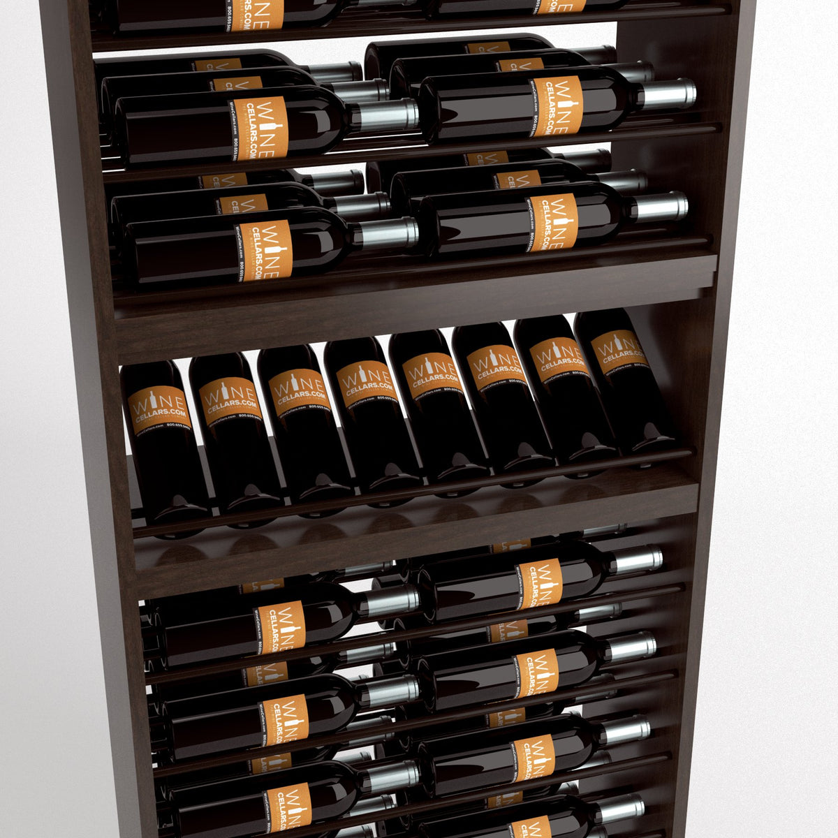 Close-up of dark wood wine bottle display rack with bottles seated in rails and a lower bottle row