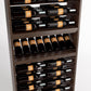 Close-up view of wine bottle rack showing horizontal rails, bottle rows, and holder