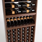 Brown wood wine rack cabinet with horizontal bottle rails, middle wine shelf, and lower cubby storage