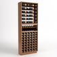 Wood wine rack cabinet with top bottle rails, black bottle cradles, and front cubby storage