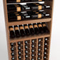 Wood wine rack interior showing bottle rails, bottle display shelf, and front cubby rows