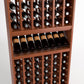 Close-up of wine rack shelving with bottle slots, horizontal tray, and rows