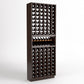 Tall wine bottle storage rack with cubby openings and a center bottle shelf