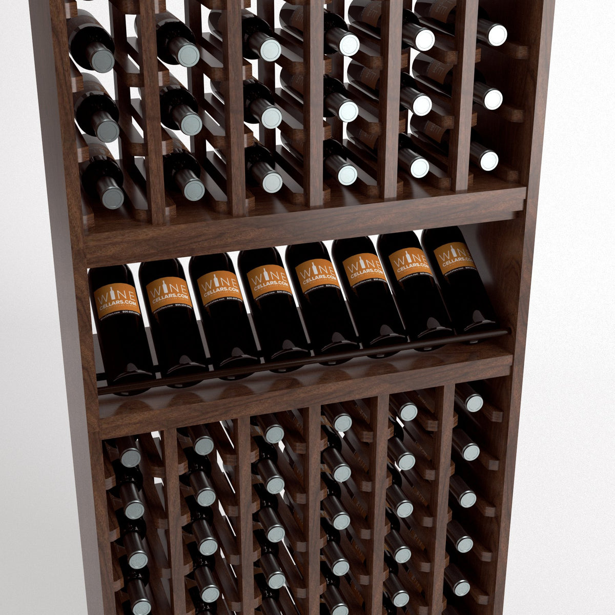 Close-up of wood wine rack shelves holding bottles in angled slots with labels facing out