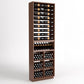 Dark wood wine storage cabinet with bottle racks and lower wine glass and bin storage