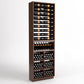 Dark wood wine storage cabinet with front-facing 6-column bottle display and storage bins