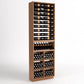 Dark wood tall wine cabinet with 6-column bottle racks, wine glass storage, and bins