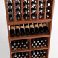 Wood wine rack section with upright bottle columns and lower tiers for stored bottles
