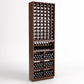 Walnut-finish wine bottle rack with 6 columns, glass holders, and storage bins