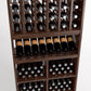 Close-up of wine rack: bottle slots above, and cubbies holding bottles below