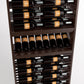 Wood wine bottle display rack with multiple horizontal rows of dark bottles, close-up.