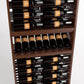 Wood wine bottle display rack showing stacked bottle rows with dark bottles and labels.