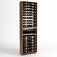 Wood wine bottle rack with 6 columns, interior shelves holding bottles and a base tray