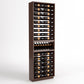 Tall wine bottle rack with six columns, bottle tray insert, and wooden frame