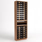 Tall wooden wine rack with 6 columns and interior shelves holding bottles
