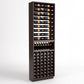 Dark wood wine rack cabinet with bottle rails on top, display shelf, and front cellar cubbies