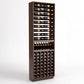 Dark wood wine rack cabinet with horizontal bottle rails, wine display shelf, and cellar slots