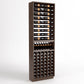 Dark wood wine rack cabinet with top bottle rails, curved cradles, and front bottle cubbies