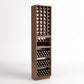 Tall wooden wine rack with bottle grid cubbies, curved wine holder tray, and drawer rows