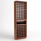 Dark brown wood wine bottle cellar rack with bottle slots and a center display shelf