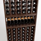 Wood wine cellar rack showing upper bottle cubbies and two lower storage shelves