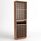 Light brown wood wine bottle cellar rack with bottle slots and center wine display shelf