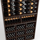 Wood wine rack close-up showing bottle rails and cubby bins with bottles