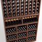 Wood wine rack detail with angled bottle holders, wine cubbies, and lower stemware compartments.