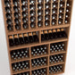 Wood wine rack detail with angled bottle holders, lower cubbies, and front wine bottle rows