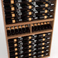 Close-up of bottle rails inside a medium wood 9-column wine rack cabinet